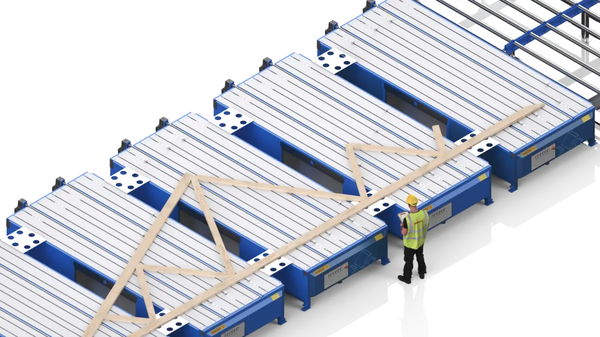 An operator laying out a roof truss on AutoEye jig tables